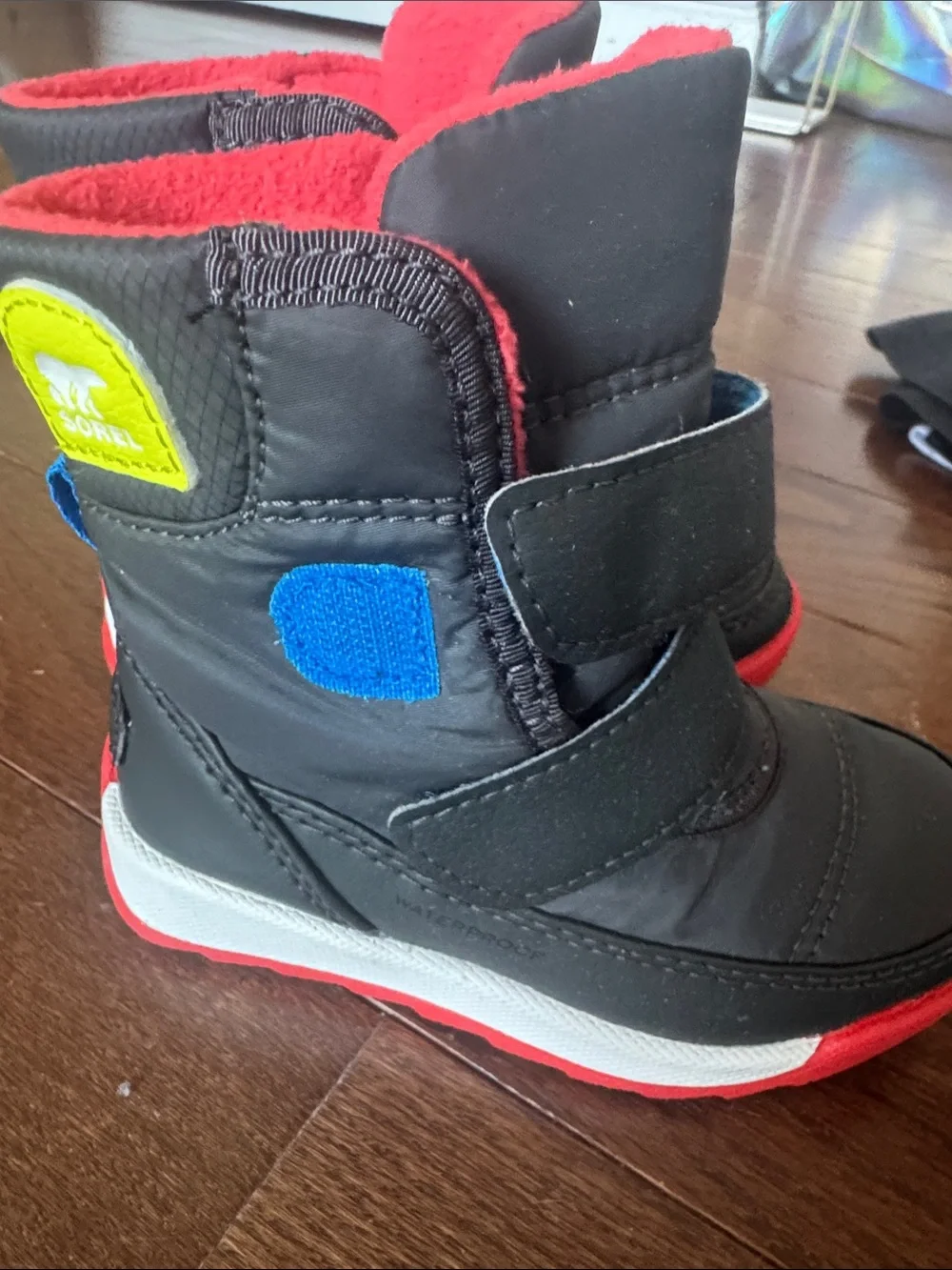 Sorel Kids Black Boots with Red Lining and Red Trim